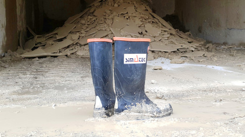 Gummisteiefel im Schlamm